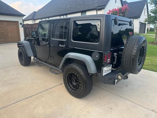 Black 2014 Jeep Wrangler Unlimited Sport