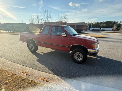 Red 1995 Toyota T100 SR5 Xtracab