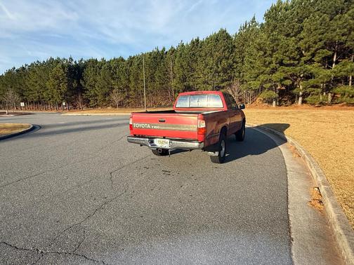 Red 1995 Toyota T100 SR5 Xtracab