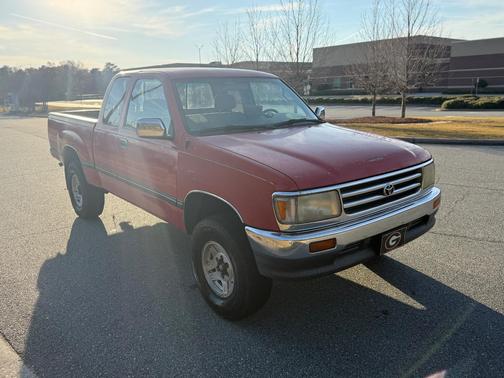 Red 1995 Toyota T100 SR5 Xtracab