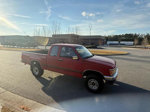 Red 1995 Toyota T100 SR5 Xtracab