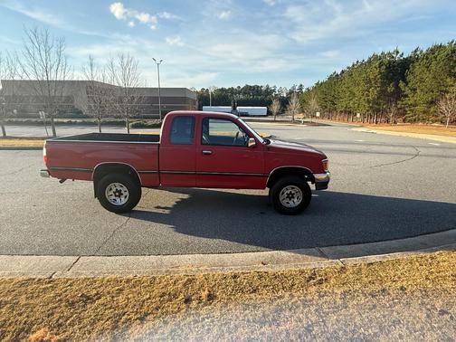 Red 1995 Toyota T100 SR5 Xtracab