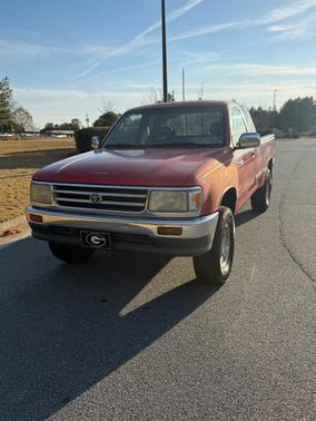 Red 1995 Toyota T100 SR5 Xtracab