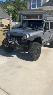 Gray 2013 Jeep Wrangler Unlimited Sport