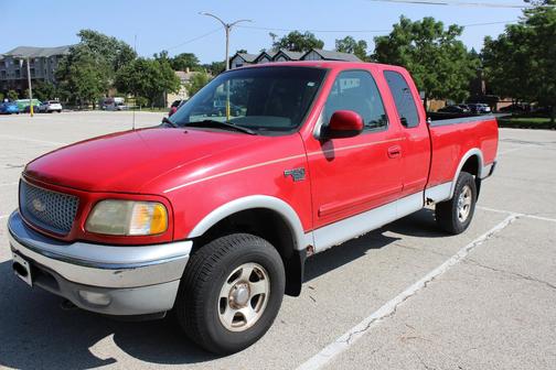 Red 1999 Ford F-150 Lariat SuperCab