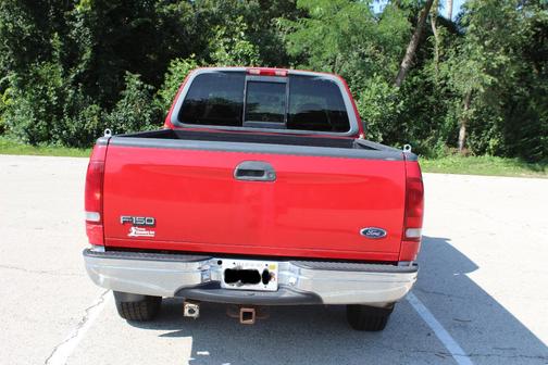 Red 1999 Ford F-150 Lariat SuperCab