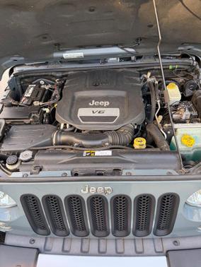 Gray 2015 Jeep Wrangler Unlimited Sahara