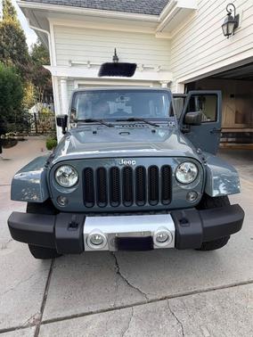 Gray 2015 Jeep Wrangler Unlimited Sahara