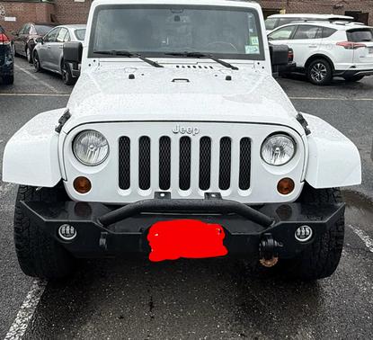 White 2013 Jeep Wrangler Unlimited Sahara