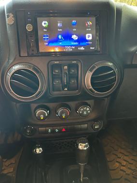 Green 2015 Jeep Wrangler Unlimited Sport