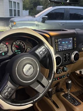White 2016 Jeep Wrangler Unlimited Sahara