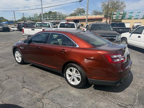Red 2015 Ford Taurus SEL