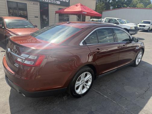 Red 2015 Ford Taurus SEL