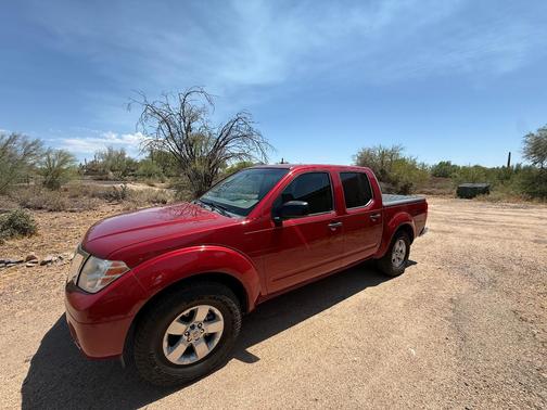 Red 2012 Nissan Frontier SV