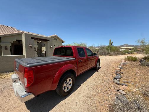 Red 2012 Nissan Frontier SV