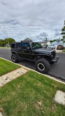 Black 2013 Jeep Wrangler Unlimited Sport