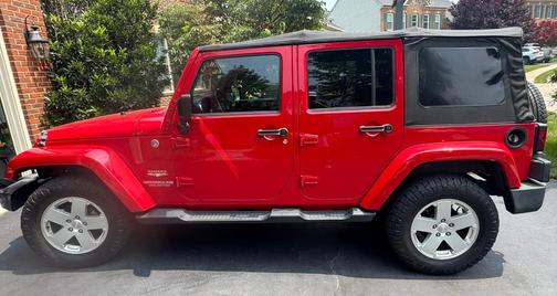Red 2012 Jeep Wrangler Unlimited Sahara