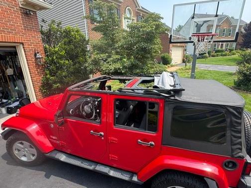 Red 2012 Jeep Wrangler Unlimited Sahara