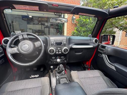 Red 2012 Jeep Wrangler Unlimited Sahara