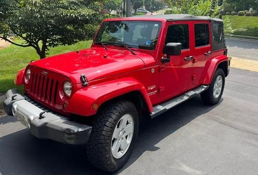 Red 2012 Jeep Wrangler Unlimited Sahara