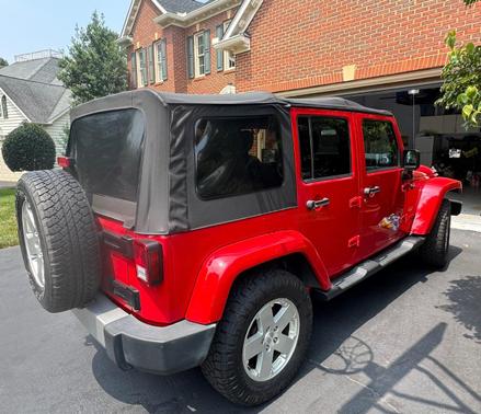 Red 2012 Jeep Wrangler Unlimited Sahara