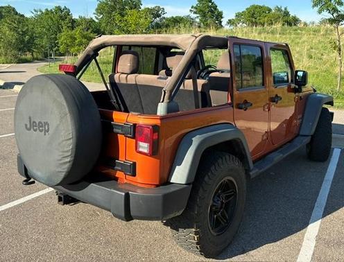 Orange 2011 Jeep Wrangler Unlimited Sport