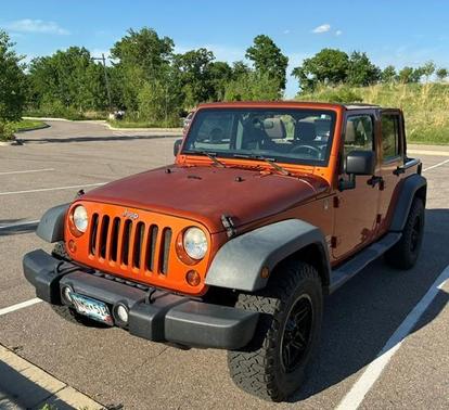 Orange 2011 Jeep Wrangler Unlimited Sport