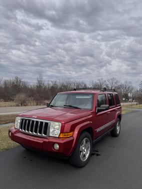 Red 2010 Jeep Commander Sport