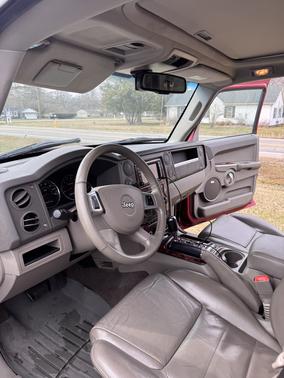 Red 2010 Jeep Commander Sport