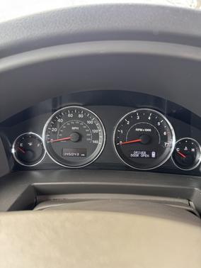 Red 2010 Jeep Commander Sport