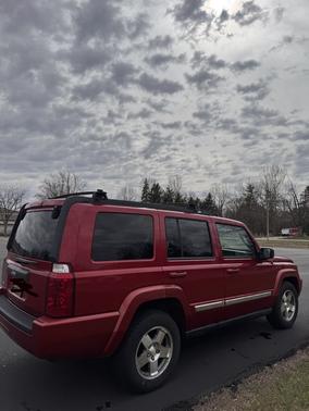 Red 2010 Jeep Commander Sport