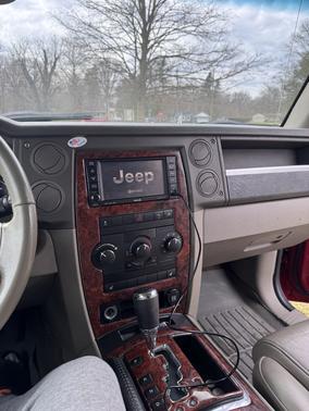 Red 2010 Jeep Commander Sport