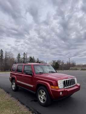 Red 2010 Jeep Commander Sport