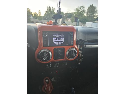 Orange 2013 Jeep Wrangler Unlimited Sahara