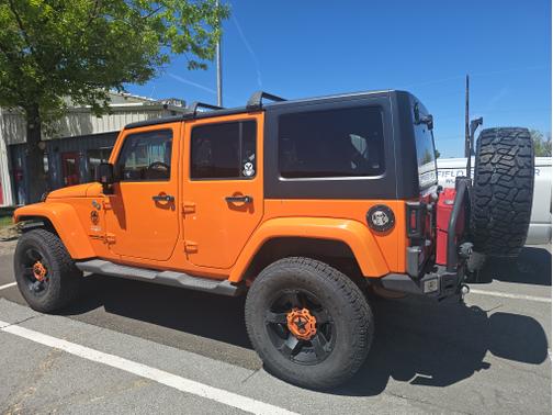 Orange 2013 Jeep Wrangler Unlimited Sahara