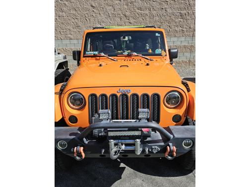 Orange 2013 Jeep Wrangler Unlimited Sahara