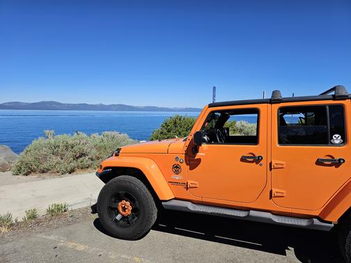 Orange 2013 Jeep Wrangler Unlimited Sahara