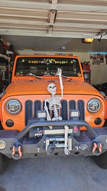 Orange 2013 Jeep Wrangler Unlimited Sahara