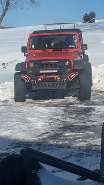 Orange 2015 Jeep Wrangler Unlimited Sport