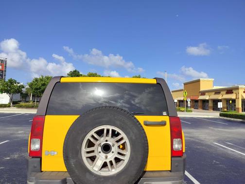 Yellow 2006 Hummer H3 Base
