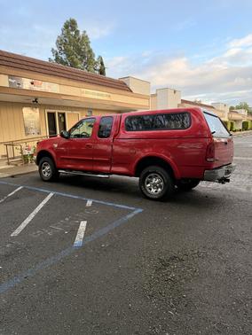 Red 2002 Ford F-150 XL SuperCab
