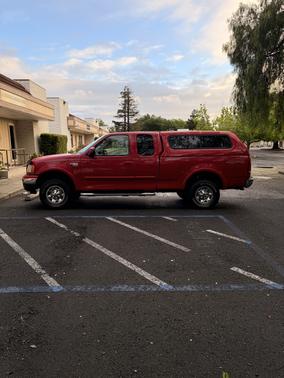 Red 2002 Ford F-150 XL SuperCab