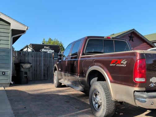 Red 2003 Ford F-250 Lariat Crew Cab Super Duty