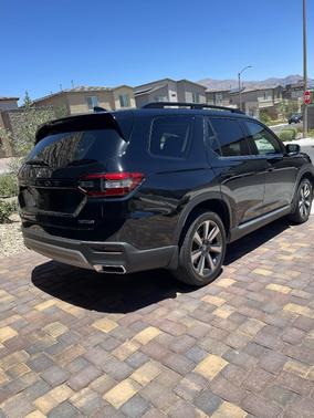 Black 2025 Honda Pilot Touring AWD