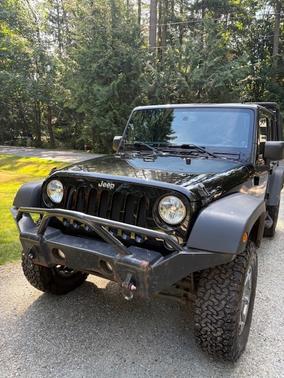 Black 2014 Jeep Wrangler Unlimited Sport