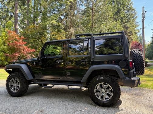 Black 2014 Jeep Wrangler Unlimited Sport