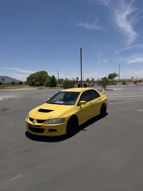 Yellow 2003 Mitsubishi Lancer Evolution Base