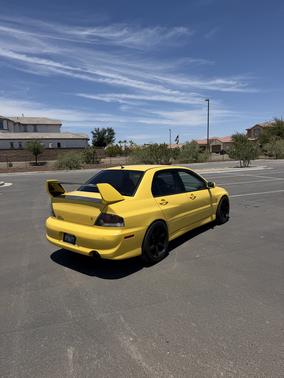 Yellow 2003 Mitsubishi Lancer Evolution Base