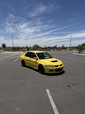 Yellow 2003 Mitsubishi Lancer Evolution Base