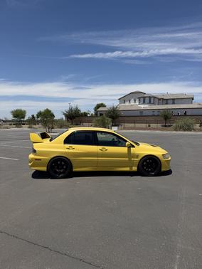Yellow 2003 Mitsubishi Lancer Evolution Base